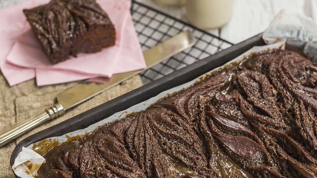 Caramel fills air bubbles in salted caramel chocolate cake served in a loaf tin
