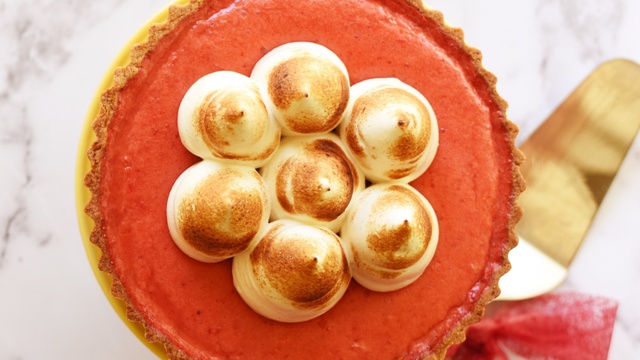 Bird's eye view of strawberry rose pie with piped circles of toasted meringue